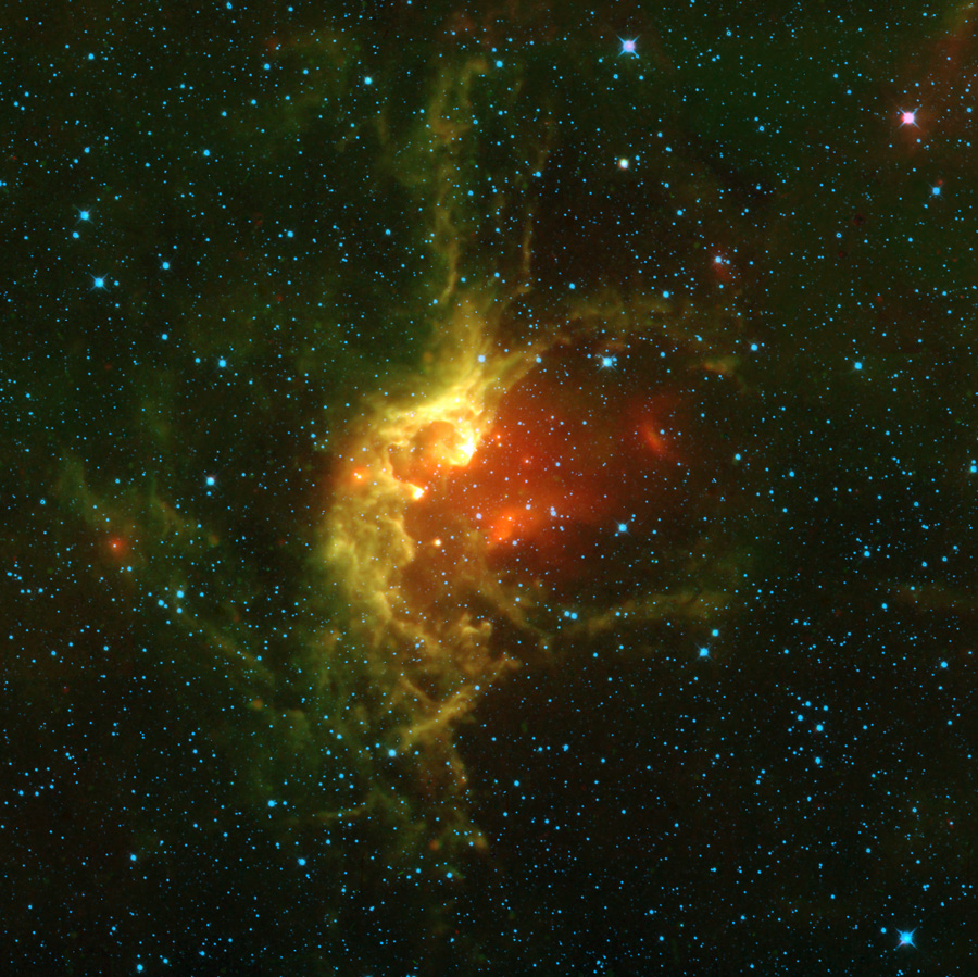 Star field with red and yellow clouds of gas in the center
