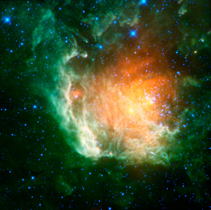 Star field with red, green  and yellow clouds of gas in the center