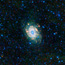 The bright white spiral in the center of the image is the Spiral Galaxy.