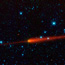 Comet 65/P Gun's tail is seen in red trailing off to the right.