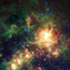 The large multicolored cloud in the center is an irregular dwarf galaxy that orbits the Milky Way.