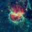 The multicolored clouds in the field of stars makeup the Lambda Centauri Nebula.