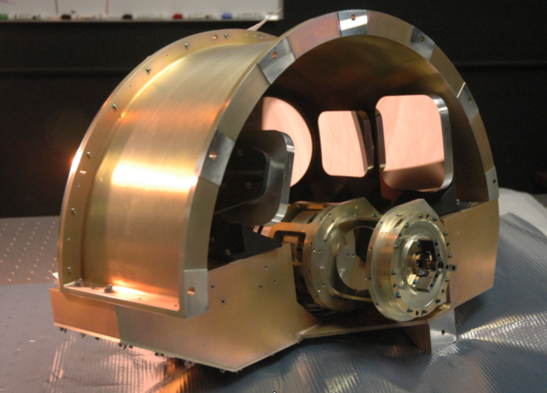 WISE Imager Optics; gold plated, domed top, flat bottom.  The mechanical system in the front resembles a small dumbbell.