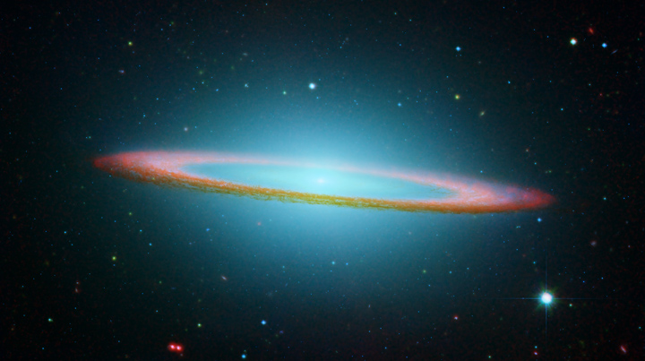 A composite visible and infrared light image from the Hubble and Spitzer Space Telescopes.