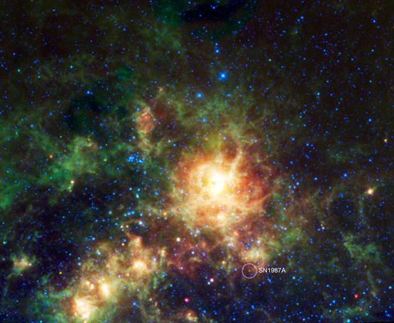 The large multicolored cloud in the center is an irregular dwarf galaxy that orbits the Milky Way.